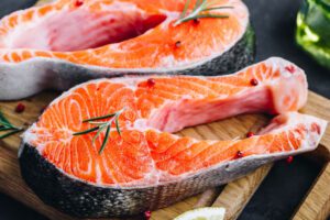 raw salmon on a cutting board