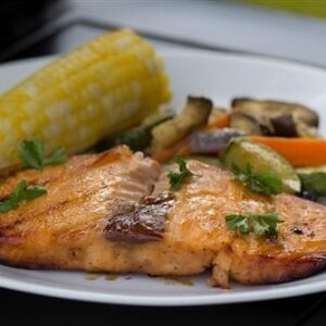 Salmon Fillet with Side of Corn and Cooked Vegetables