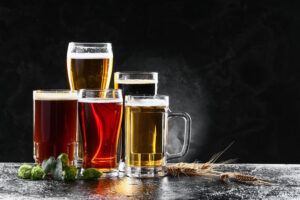 a few glasses of beer sitting on a table